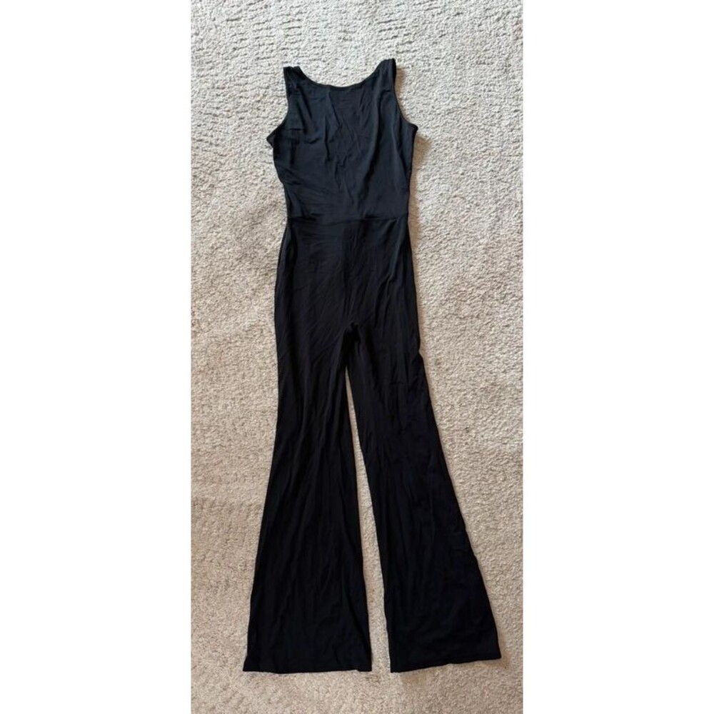 Black sleeveless & backless jumpsuit w/ butt scrunch & flare leg - size L- EUC!!